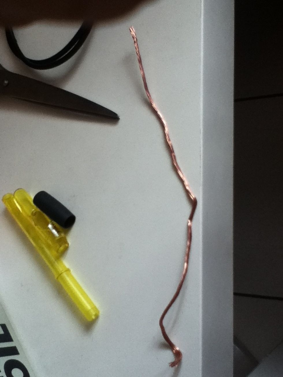 Strip a wire. I used stranded but you can use any wire. We'll use this as a conductor of static energy.