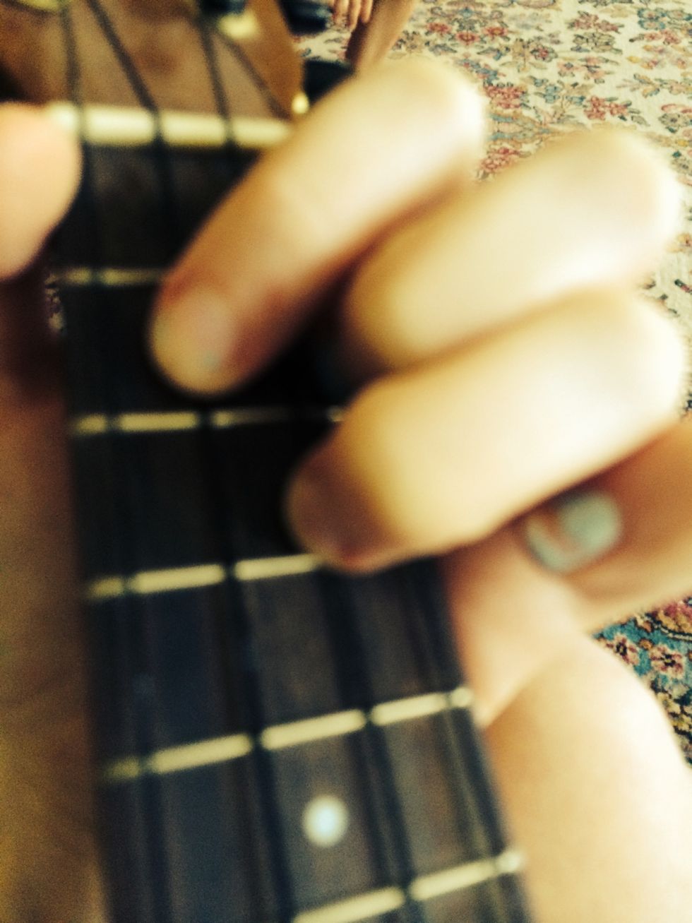 Strum once to make sure it sounds right. (Sorry it's blurry)