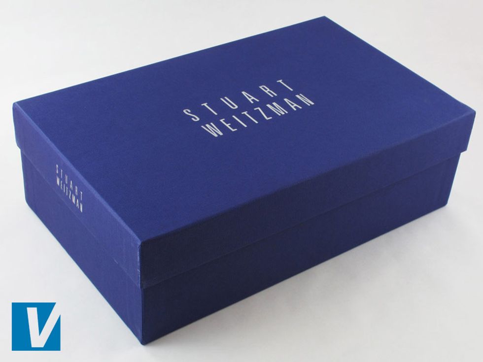 Stuart Weitzman shoes are boxed in a strong blue purple box with the 'STUART WEITZMAN' logo across the middle in silver. Check the size, font and placement of the logo carefully.