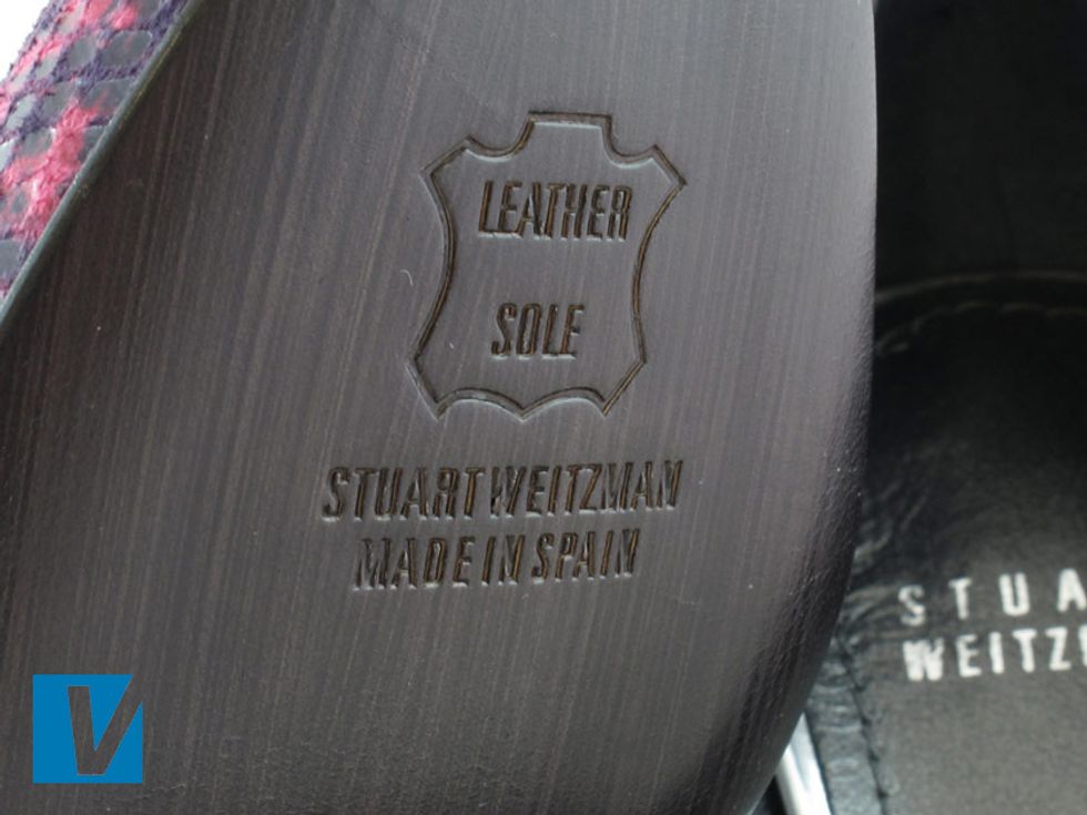 Stuart Weitzman shoes usually feature a leather sole with the 'STUART WEITZMAN' logo detailed, along with 'MADE IN SPAIN' and 'LEATHER SOLE' written in a boxed emblem.