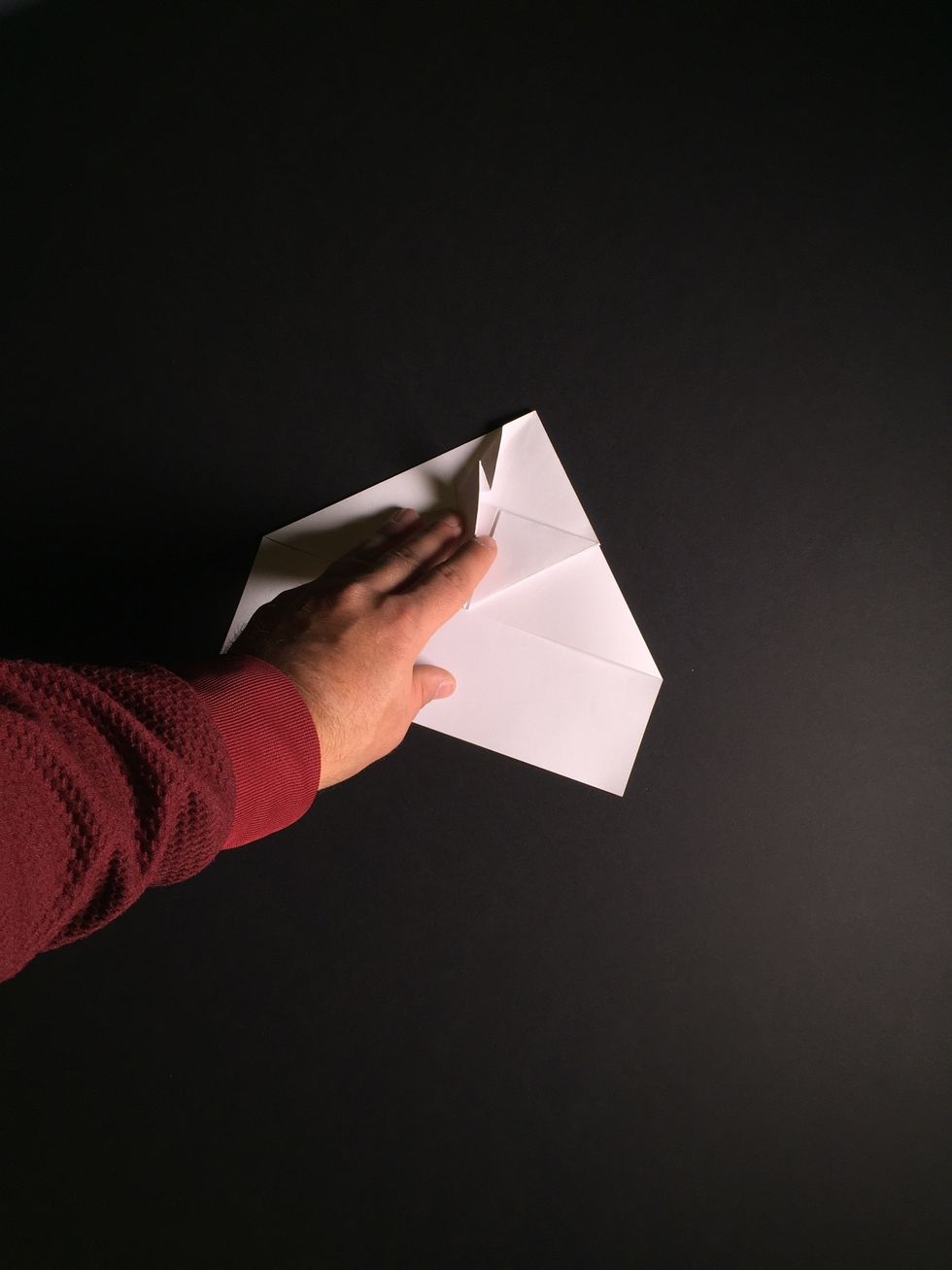 Study the photos from steps 16 and 17. Duplicate them as shown in the photos by tucking the top left flap into the previous 2/3 crease.