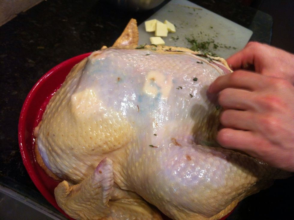 Stuff cavity of turkey with seasonings (onion, celery, apple, orange, etc.) Insert pats of butter and chopped herbs (thyme, sage, rosemary) between skin and meat.