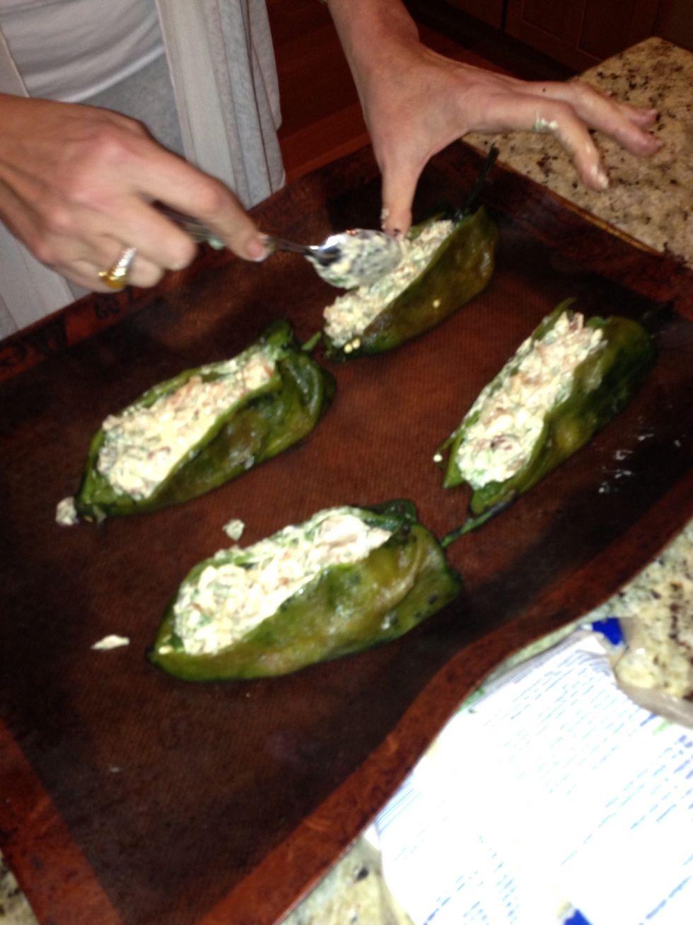 Stuff mixture into the poblano peppers. Top with the Panko breadcrumbs and bake on non stick pan for 15 to 20 minutes.