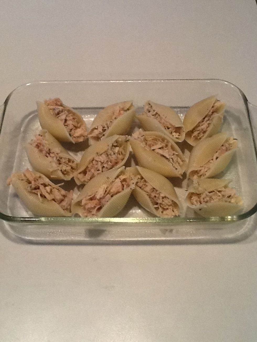 Stuff shells with chicken mixture.  If you have extra chicken left over, just add some mayo, celery, and onion and enjoy some chicken salad tomorrow go lunch!  :-)