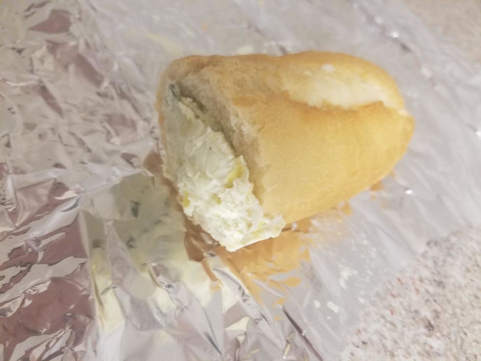 Stuff the baguette quarters with the spinach and artichoke dip, using a spoon to help pack the dip.