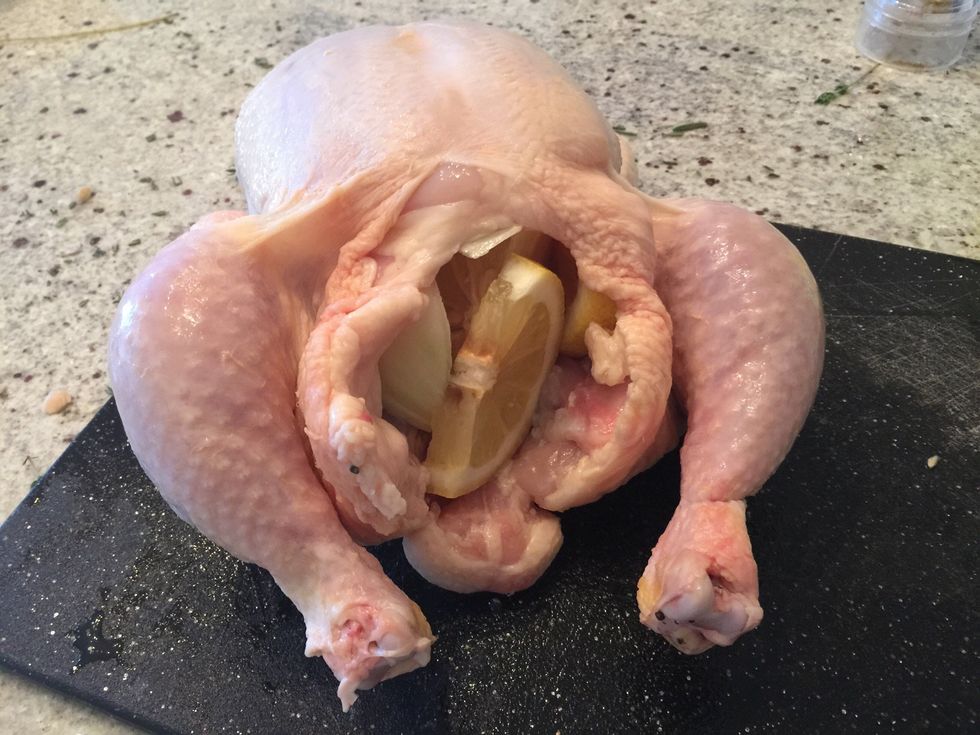 Stuff the chicken with onion and lemon