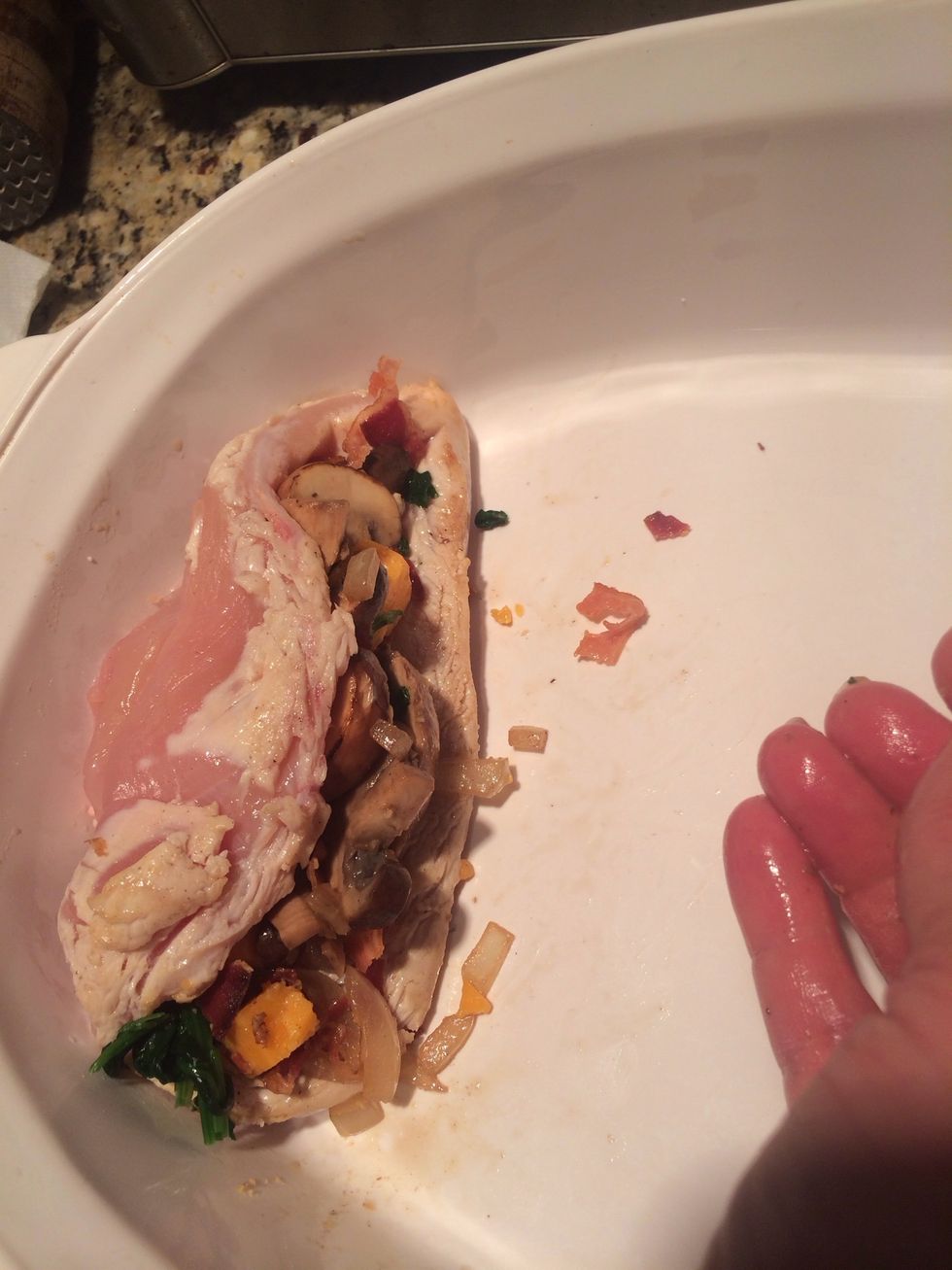 Stuff the chicken with the cheese, mushroom and onions, spinach and Bacon