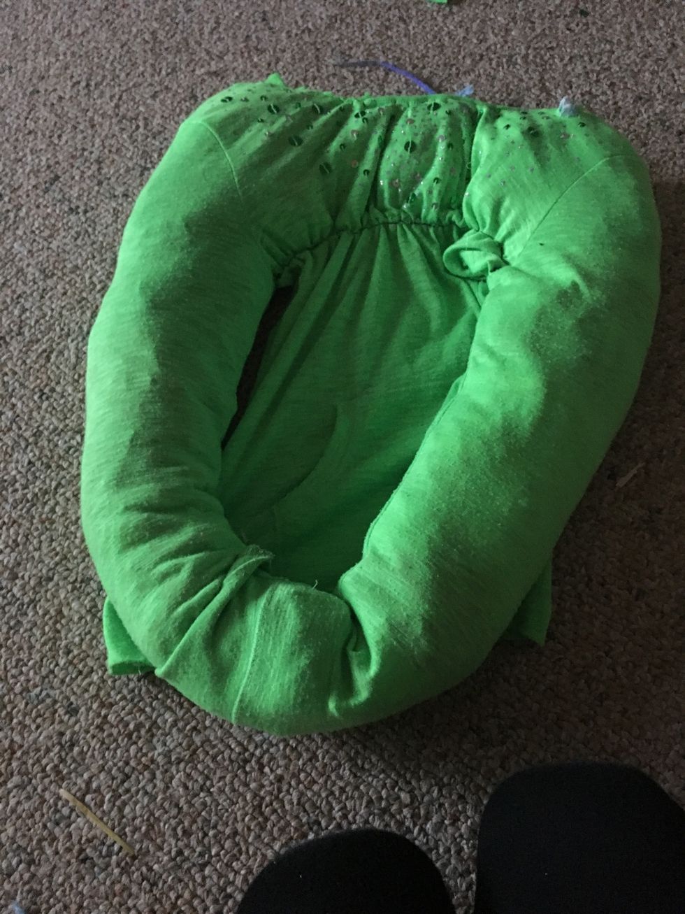 Stuff with stuffing(or old clothes) and put the arms together