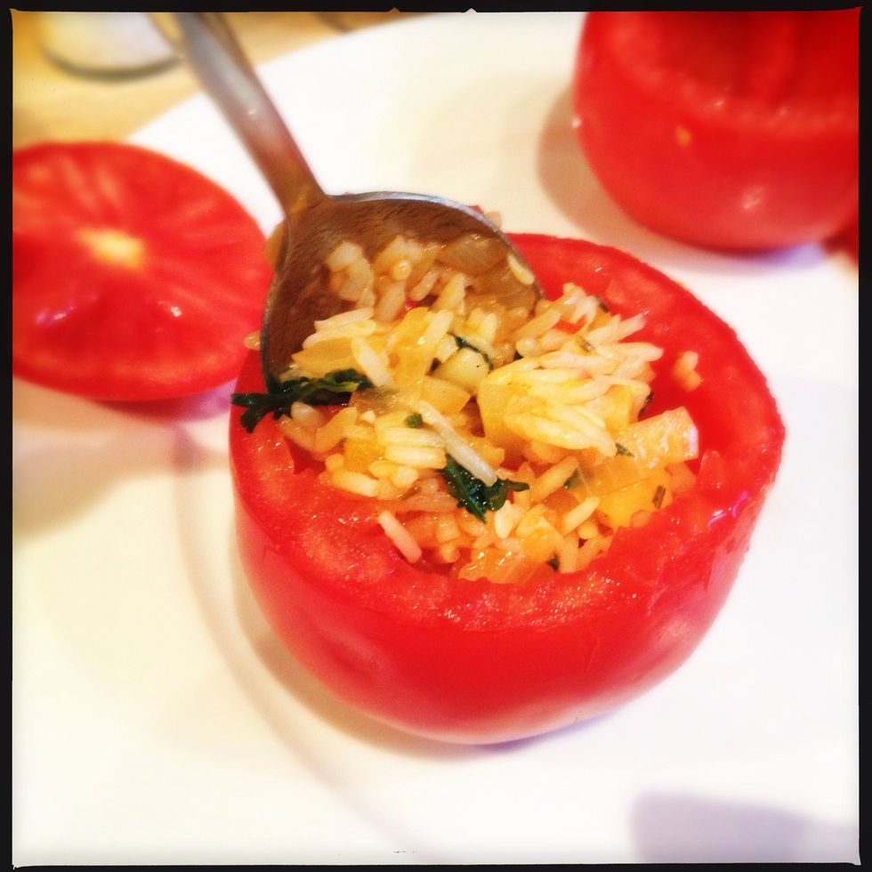 Stuff your hollowed tomatoes and press hard (not too hard or the tomato will break) and fill it up rich.