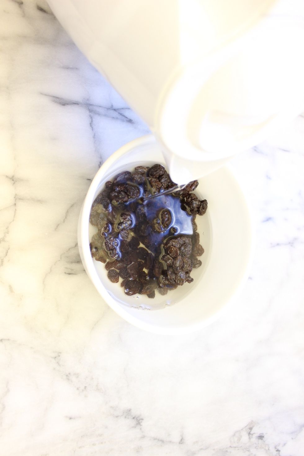 Submerge the raisins in hot water for 10 minutes.