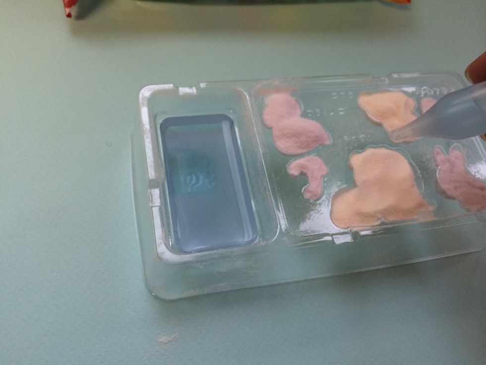 Suck gummy activator liquid into dropper