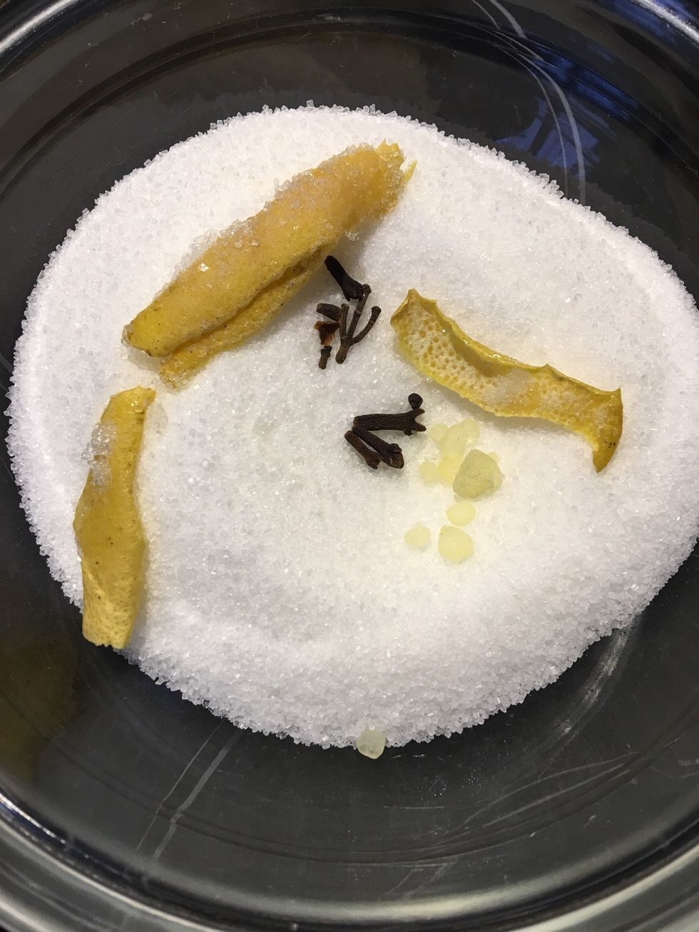 Sugar, lemon rind, cloves and for the authentic flavor.. 4-5 grains of mastica (Greek or oriental stores) or on line. If not, then vanilla bean. Add water bring to a boil