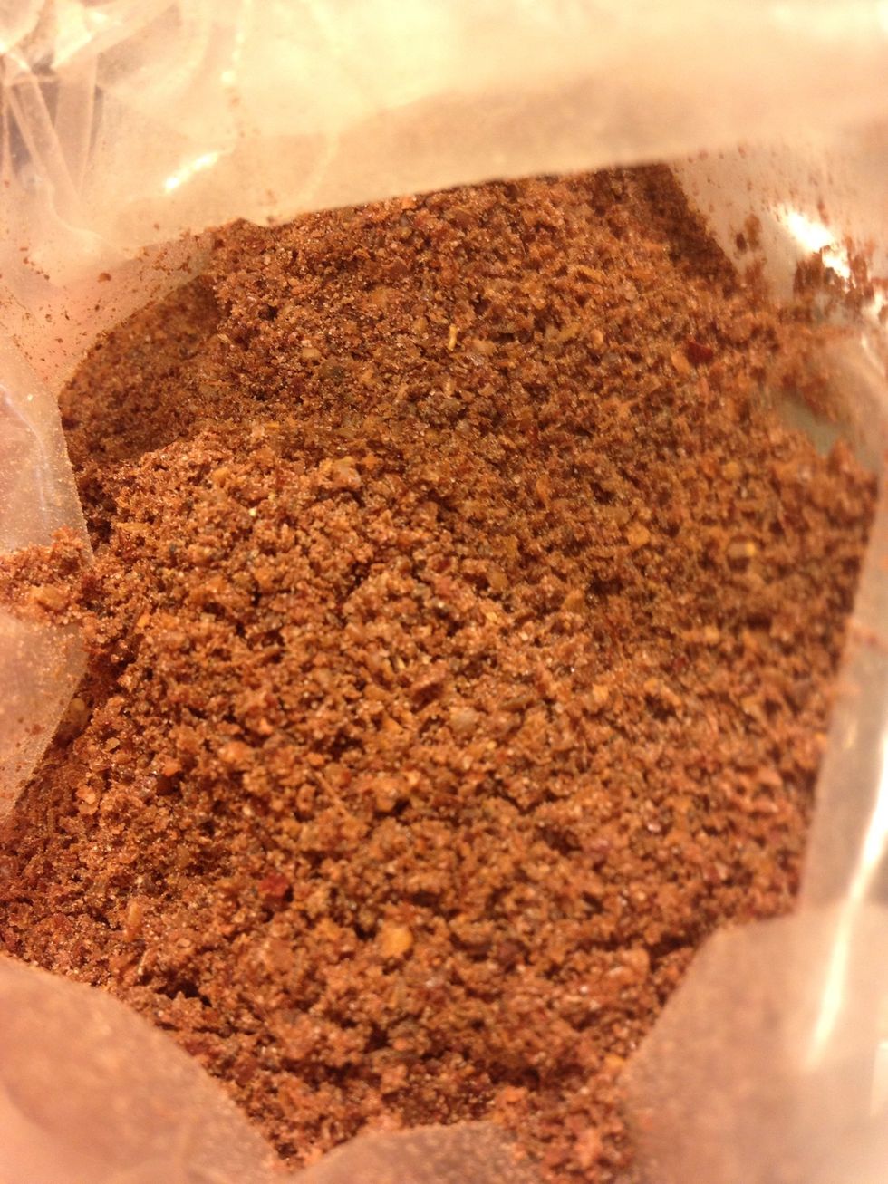 Sumac-an astringent berry picked before ripe dried and sold whole or ground, it's used as a spice in Middle Eastern cuisine to add a lemony taste, used at table side on rice and kababs.