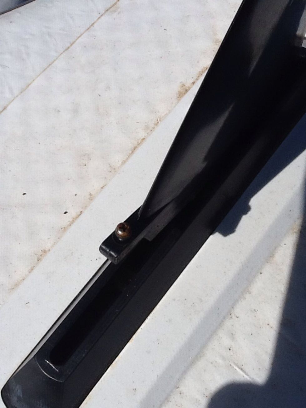 Surfer Fin - Step 3 - line up the screw with the flat nut that sits down in the groove.  The nut slides in the groove so take your time lining them up perfectly.  Push the fin down to connect them.