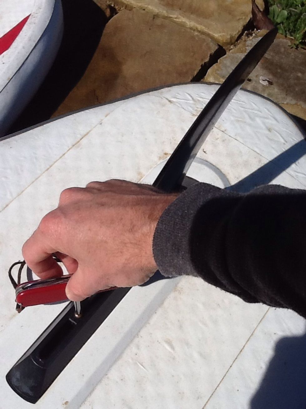 Surfer Fin - Step 4 - tighten the screw and nut. Make sure they connect and the screws catch. Don't over tighten. Pull back on the fin to make sure it's secure. Now you are off to SUP.