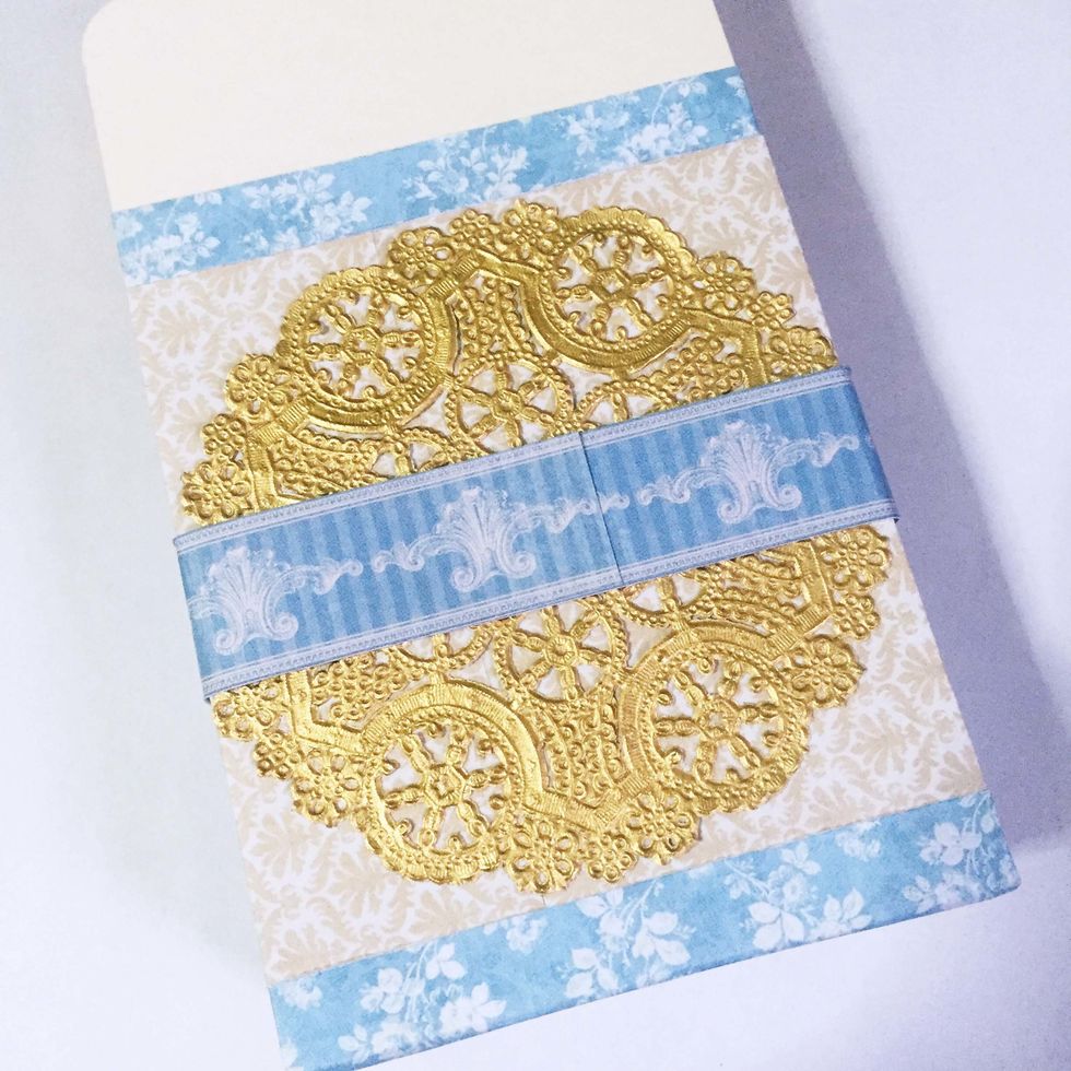 Surround the box with some pattern paper strips or ribbons if you'd like to.