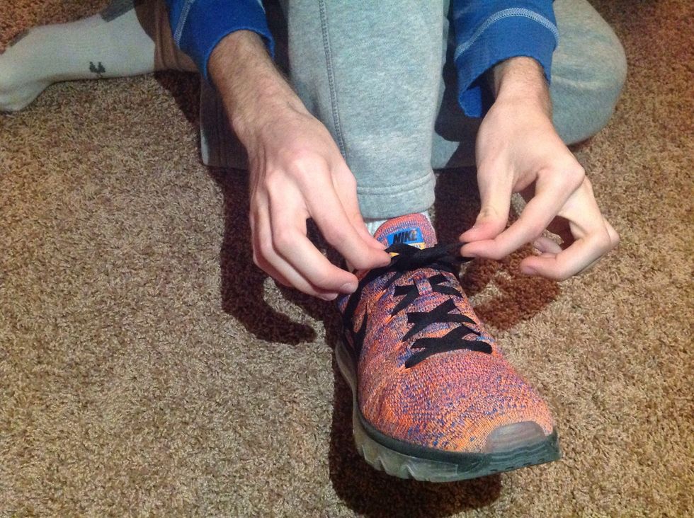 Swap the loose end of the laces with one another. To make sure you did it right,it should look like a flattened pretzel.