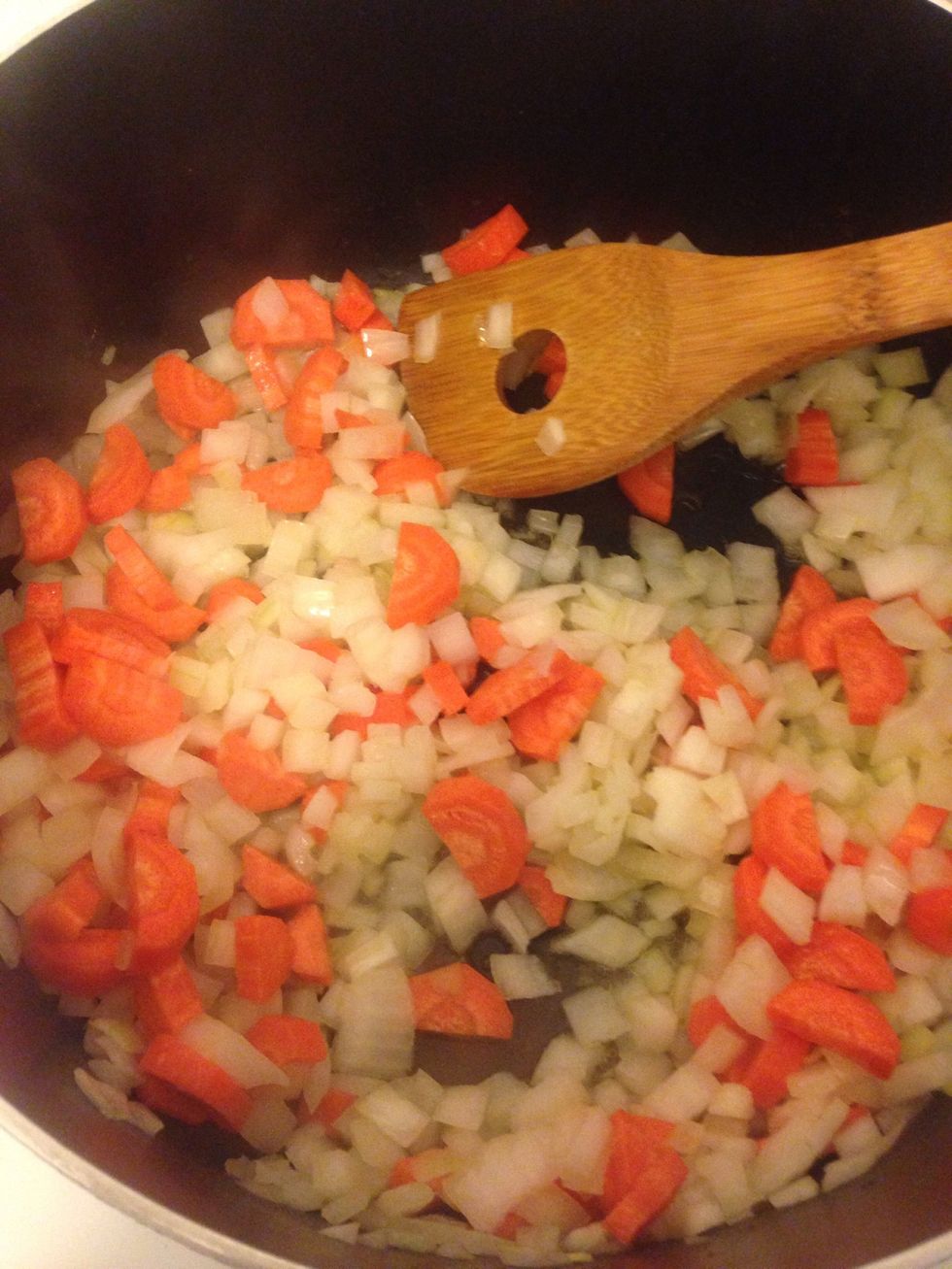 Sweat carrots and onions for 10 minutes.