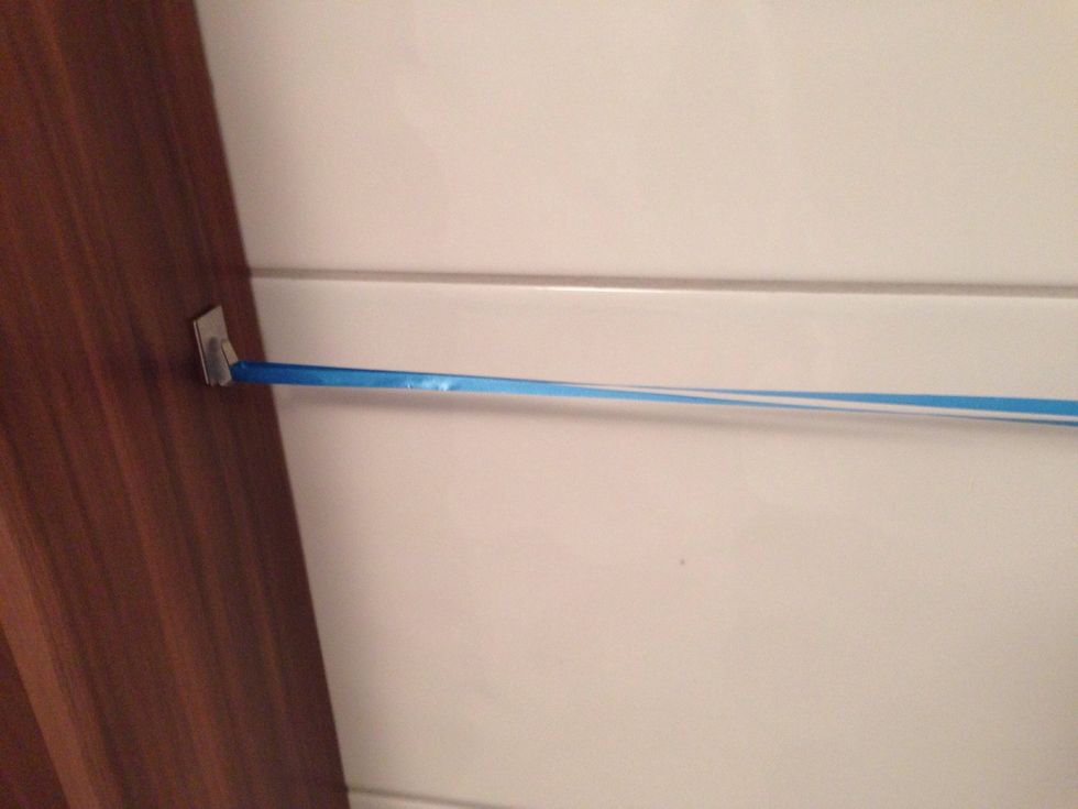 Swing ribbon around one of the hooks