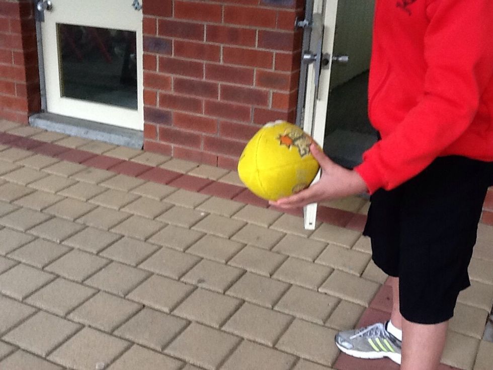 Swing your arm back far.