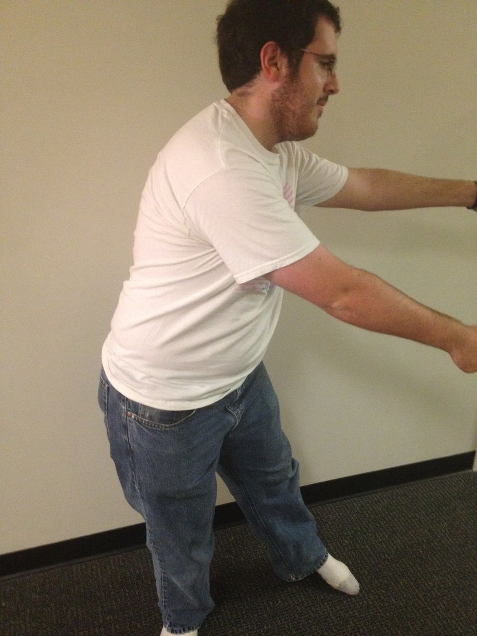 Swing your arms back to your right. At the same time, swing your hips to the left. Steps 5 and 7 should look identical.