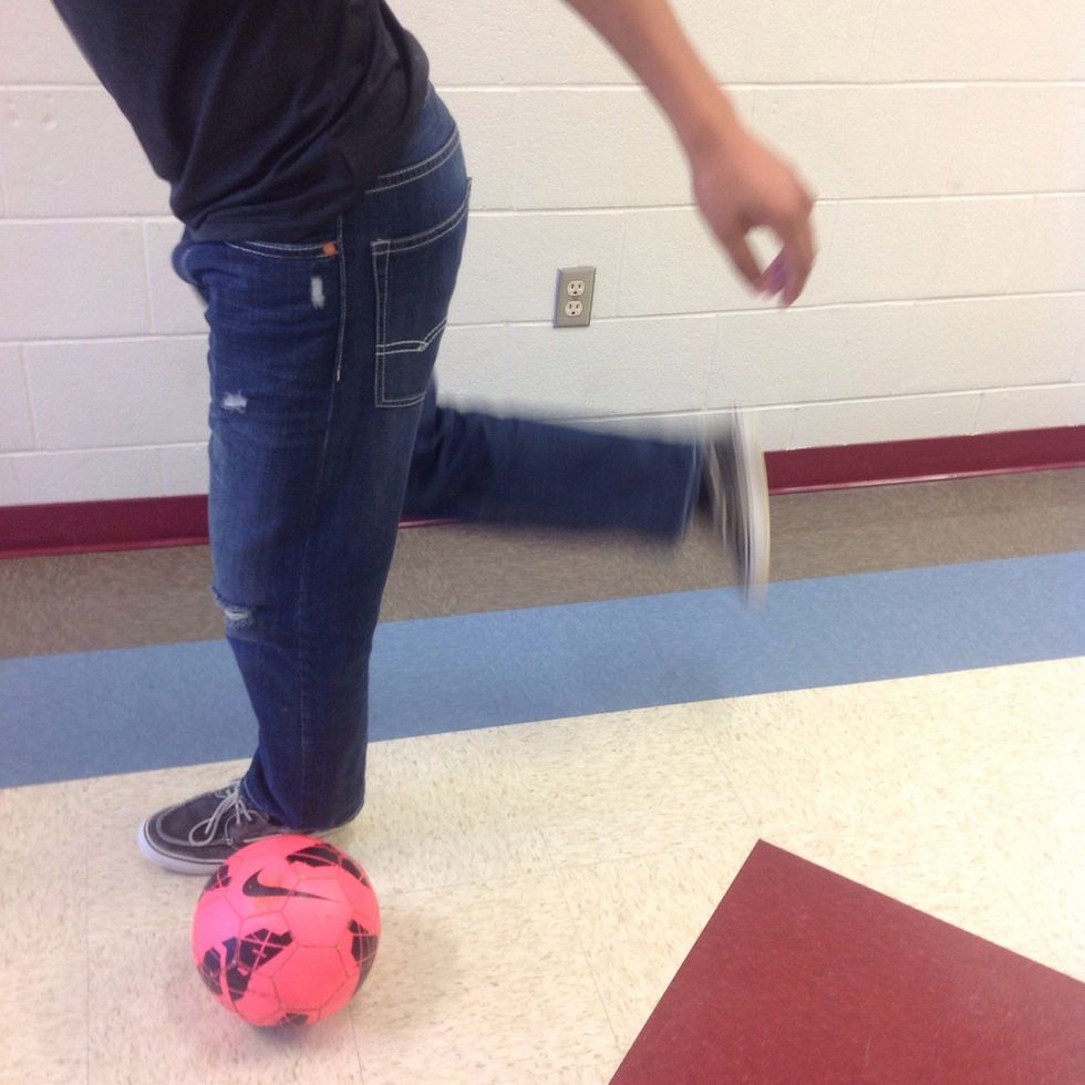 Swing your kicking foot around the back of your planted leg