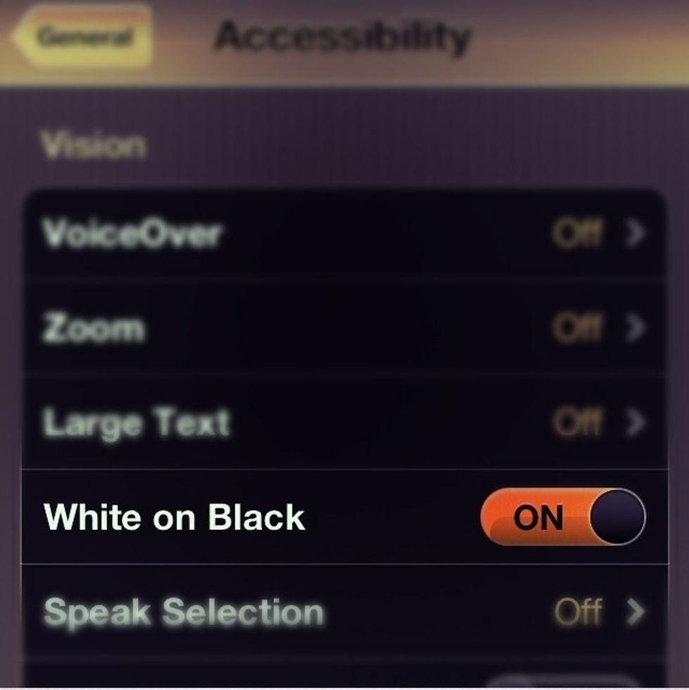 Swipe the 'White on Black' setting to ON, and enjoy!
