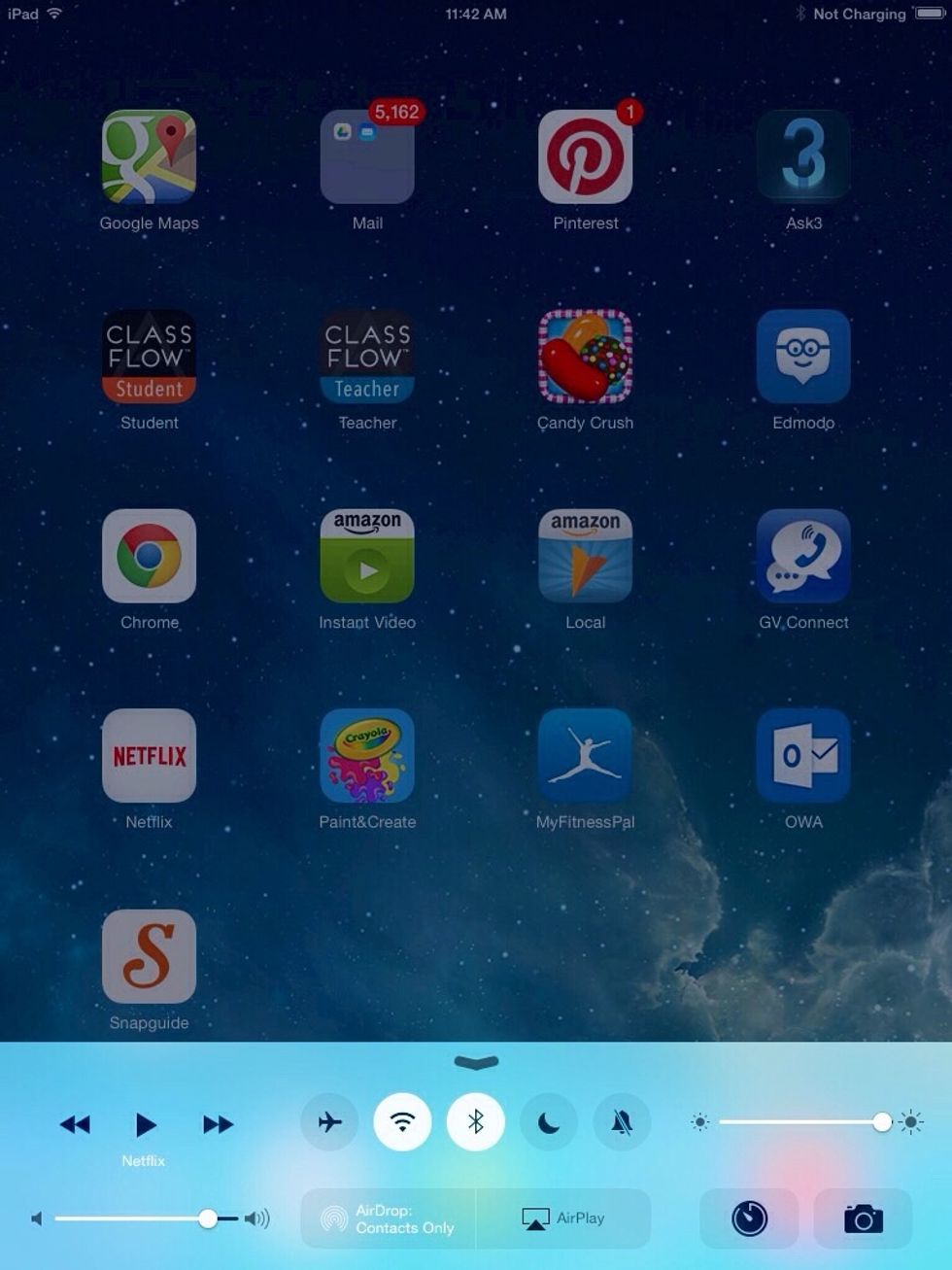 Swipe up with one finger from below the bottom edge to just above the bottom edge of your iPad screen to reveal the control panel.