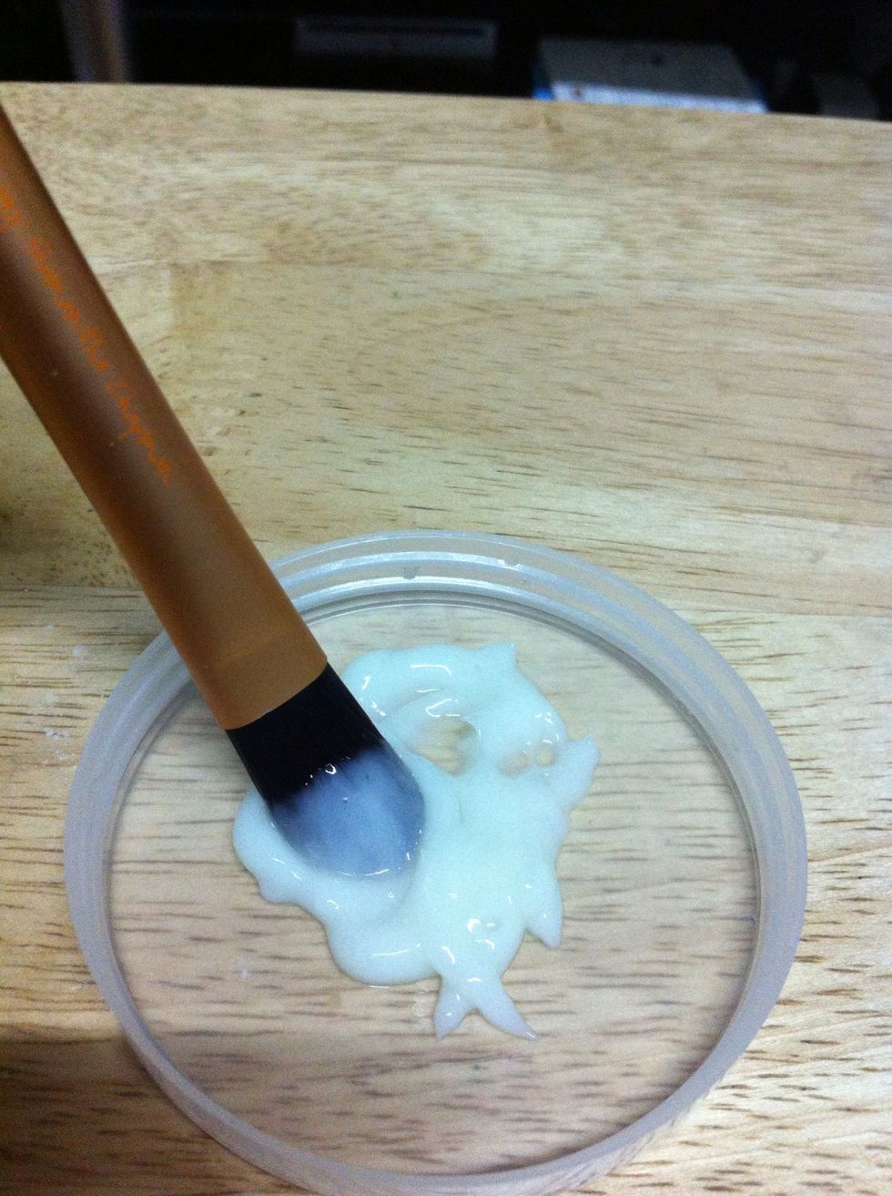 Swirl the brush on the conditioner, make sure the bristles are completely covered.