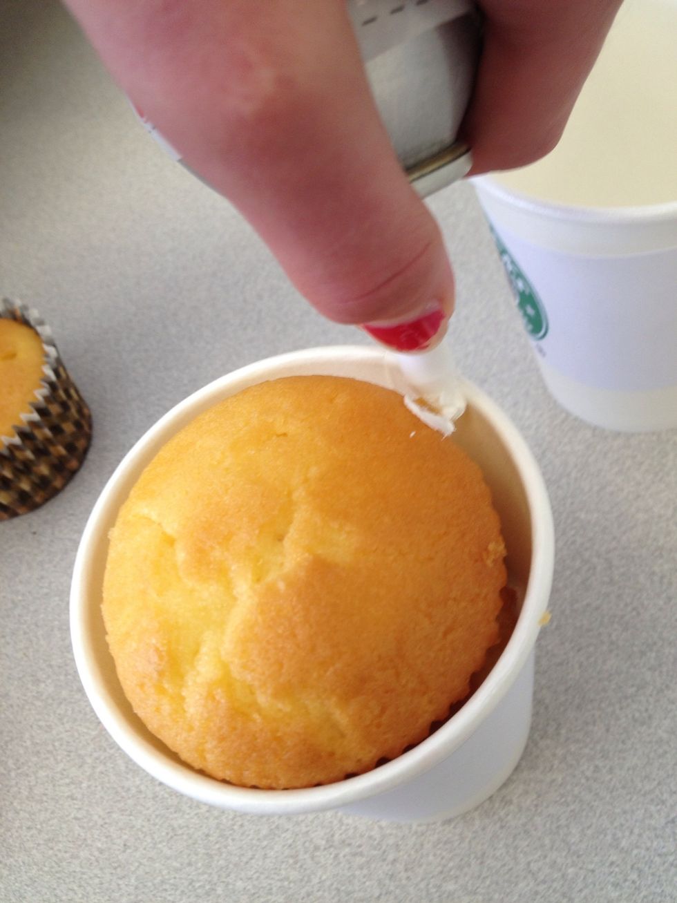 Swirl the icing around the muffin to get desired look of whipped cream on a milkshake