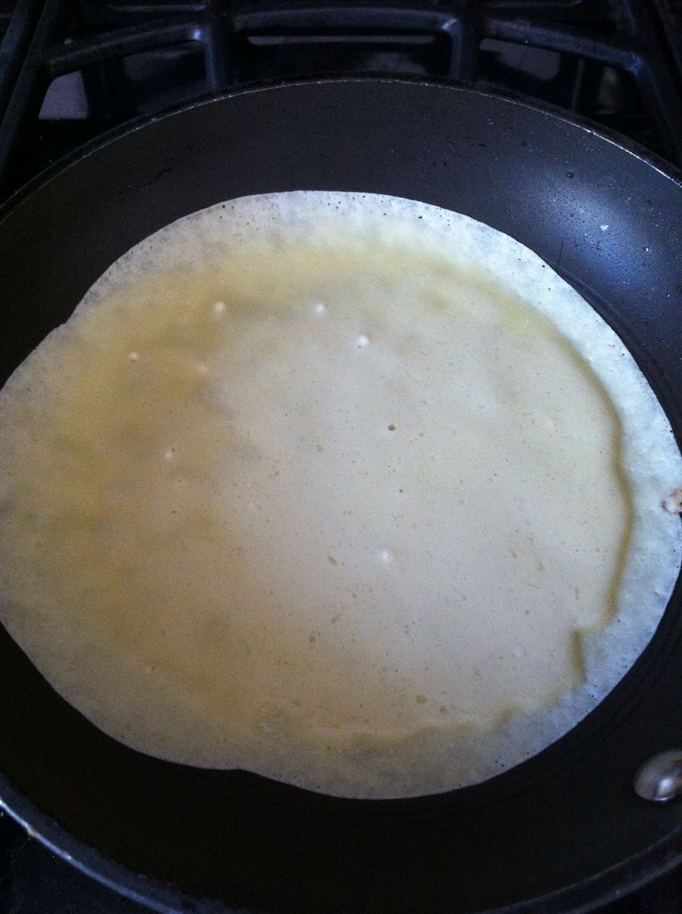 Swirl your pan around, making sure to coat the bottom of your pan. You may add more batter if there are empty spots in the pan.