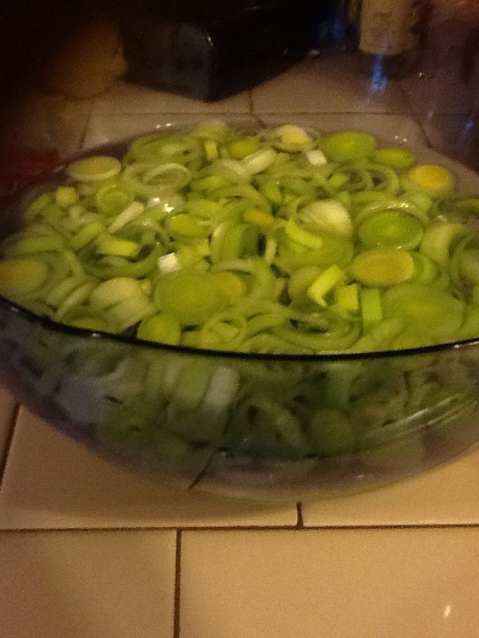 Swish your chopped leeks in a bowl of water. All the sand will sink to the bottom and you'll scoop up sand-free leeks.