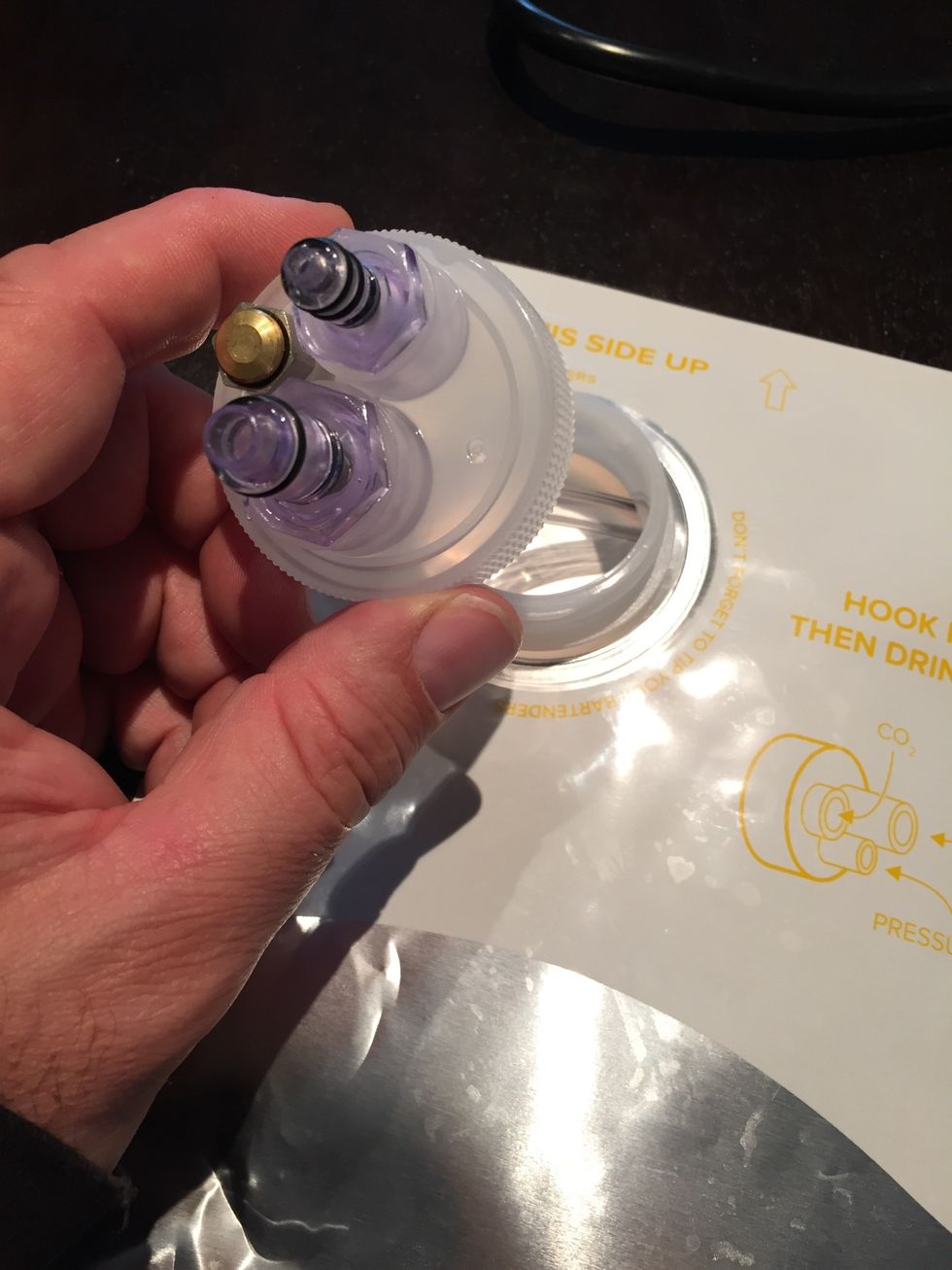 SYNEK CAP: Insert tube and screw on cap. Have brewer fill to 128 ounces. Connect bag to the Synek and allow to get to temperature. Then drink cold beer.