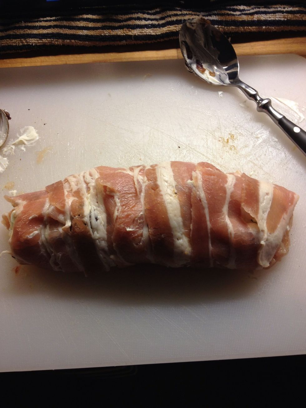 Ta da! :) Wrapped tight with no gaps. Make sure the breast is completely covered & the edges. Pop in the oven on a greased baking tray for 35-40 mins once bacon is crisp.