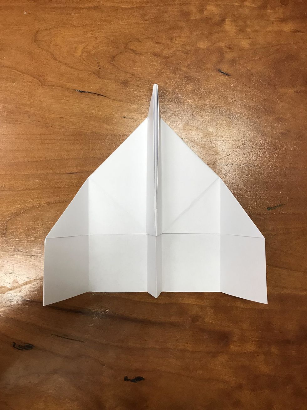 Ta-Da! You now have a paper airplane that will win at the airshow! Feel free to decorate your masterpiece with markers, colored pencils, or crayons.