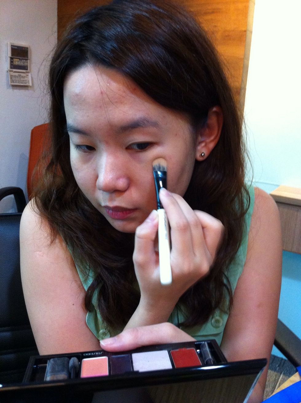 Tab the brush softly on red spot