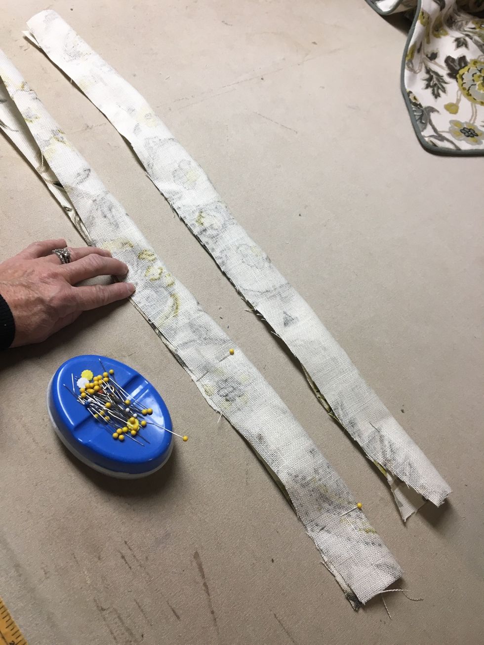 TABS:  Fold tab strips in half, right sides together and pin or staple.  Stitch down the long side and across one end to make 2 tubes.