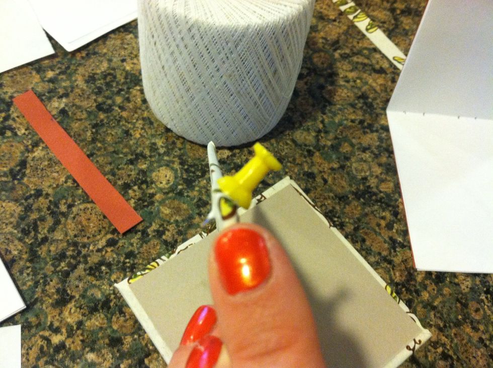 Tack should be positioned diagonally inside cover to outside cover