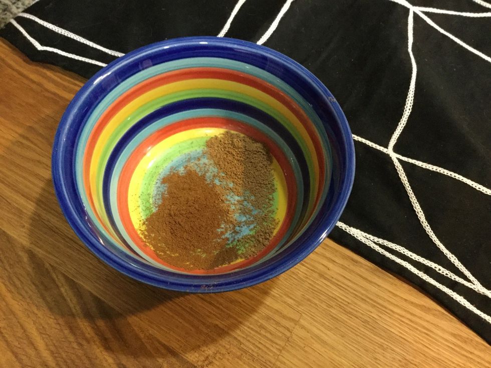 Take 1/2 teaspoon of nutmeg and add it to the bowl.