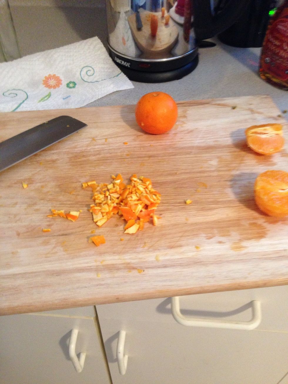 Take 1/4 of the orange peel and slide it into small pieces or zest the orange.