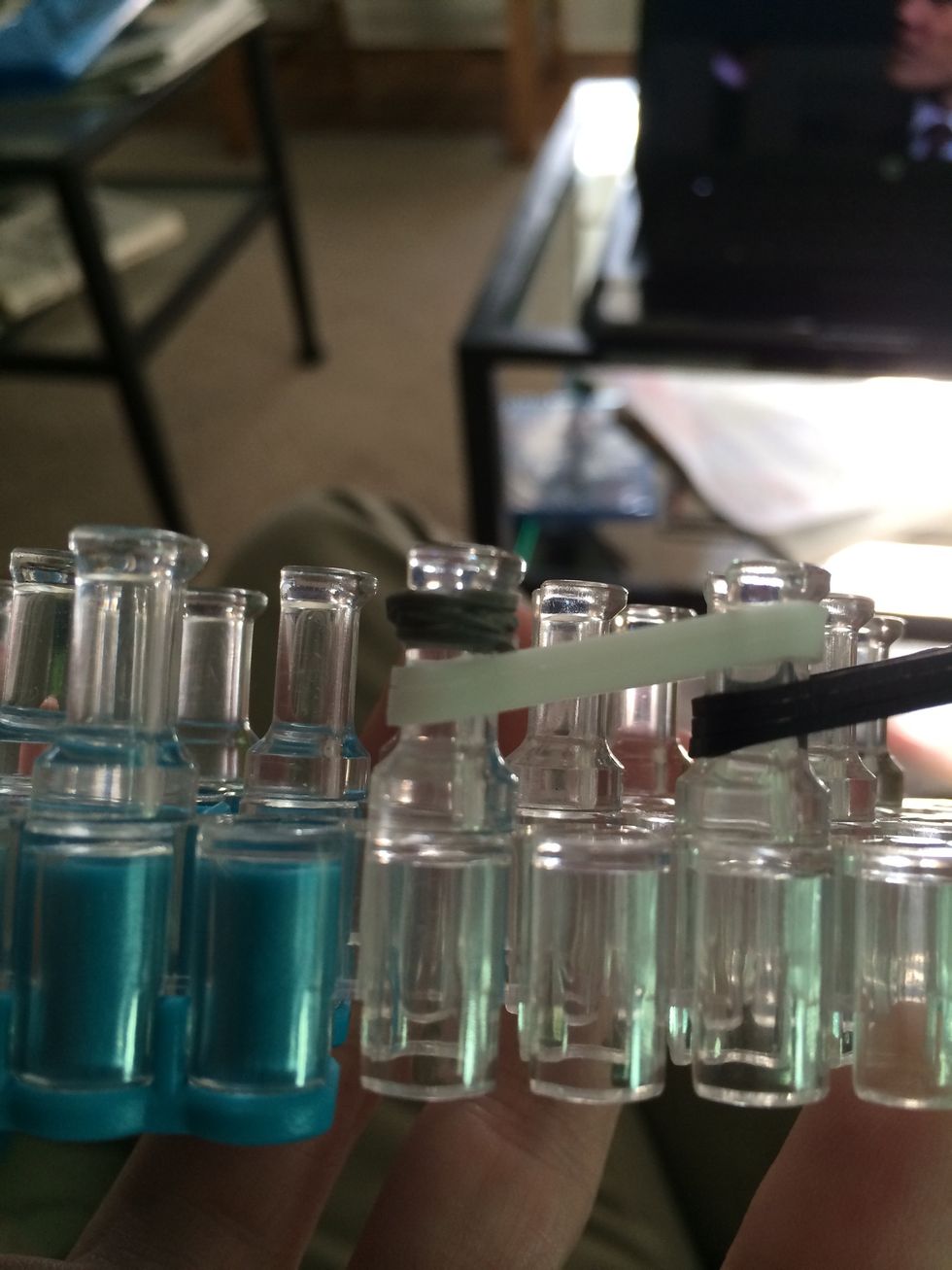 Take 1 grey band and wrap it around the hook 3 times.