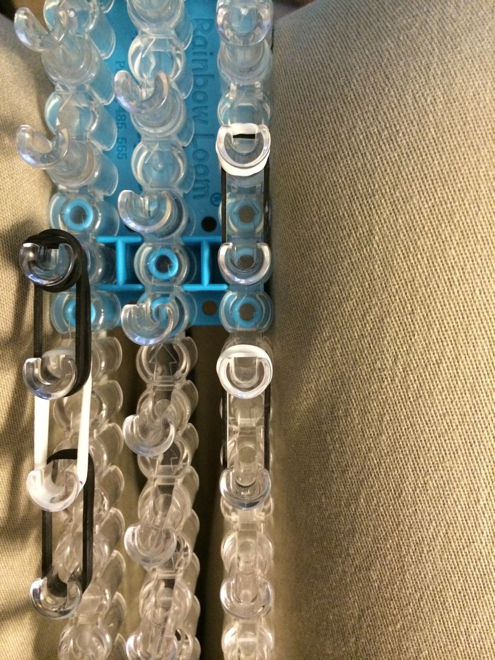 Take 1 white band and wrap it around each ear 3 times.