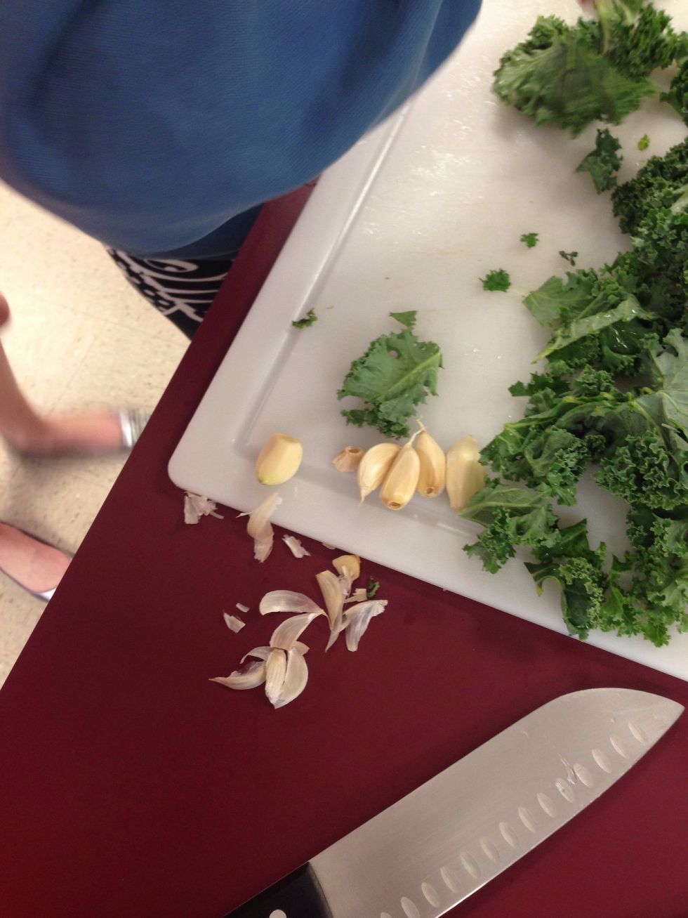 Take 2 garlic cloves, peel and chop coarsely