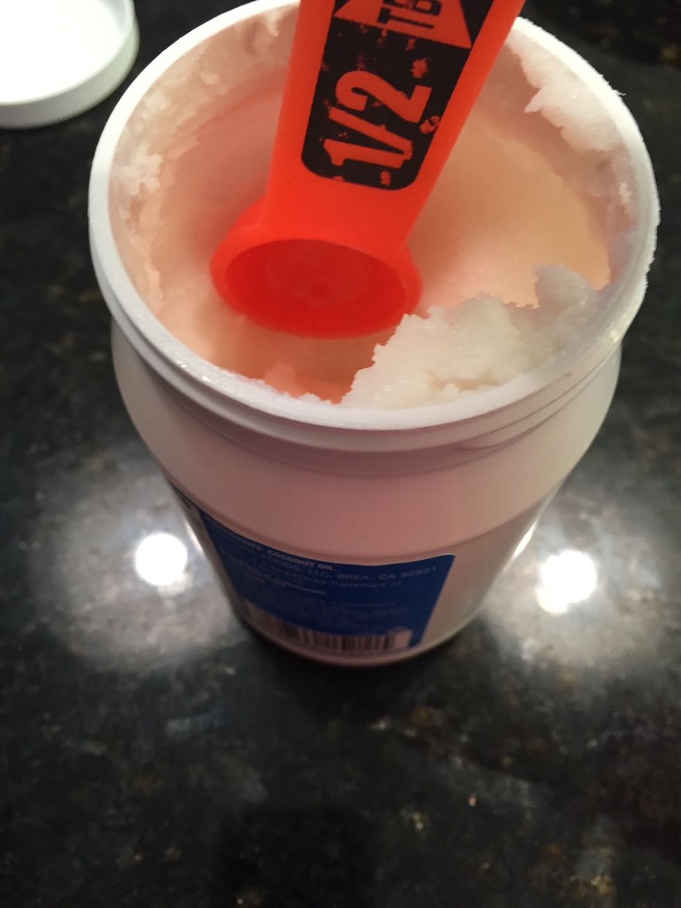 Take 2 teaspoons of coconut oil and place it in the bowl