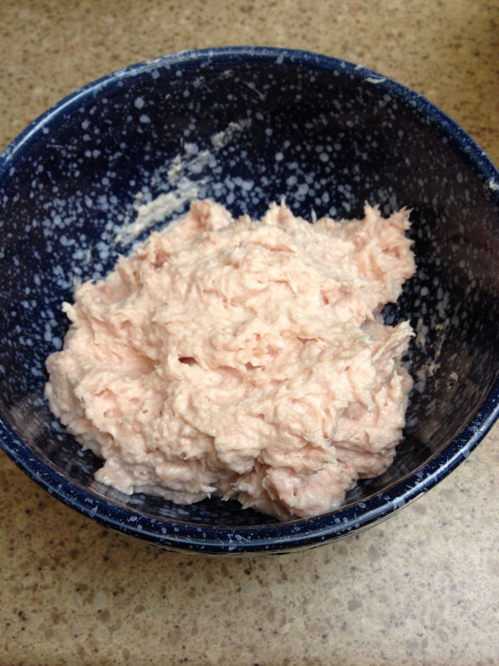 Take 3/4 of the package of bacon and add it to the food processor. Process the bacon until it is smooth and free of chunks or stringy prices of bacon. This will be worked into the beef later.