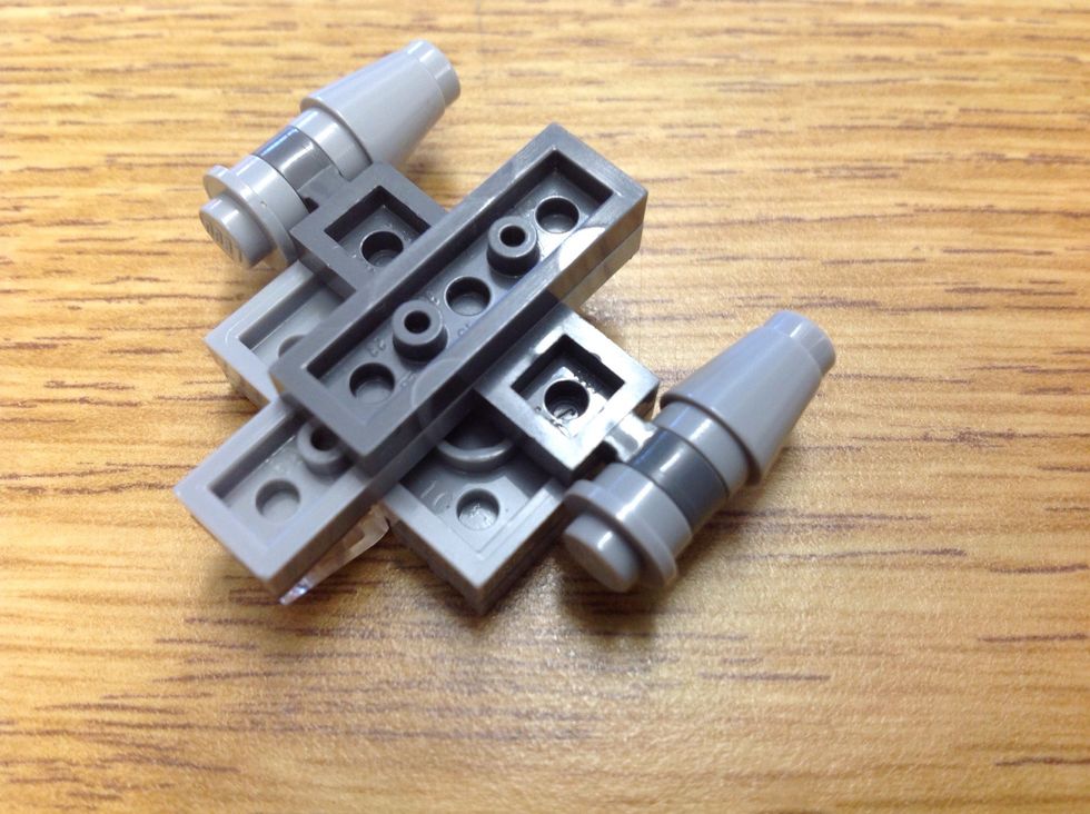 Take a 1x1 with thing at end, a stud and a cone. Make two and connect at back or front. Flip.