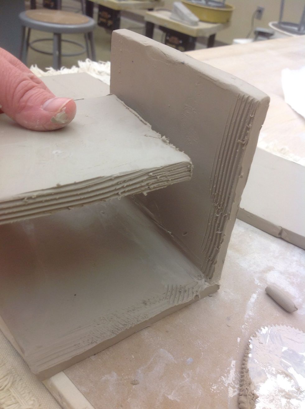 Take a "B" piece and slip and score two edges and the sides of both A pieces.