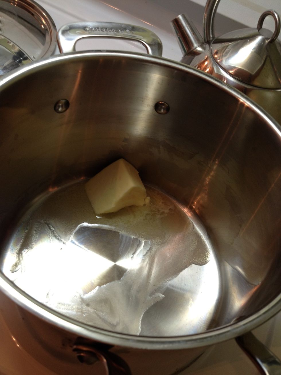 Take a big ol' hunk of butter and melt it in a large pot.