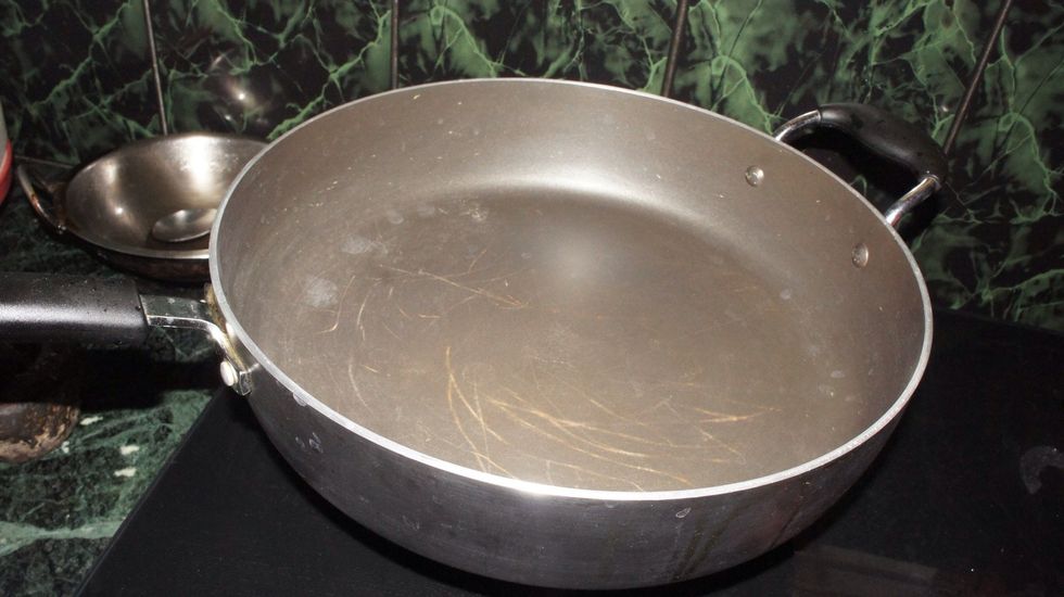 Take a big pan for cooking biryani..