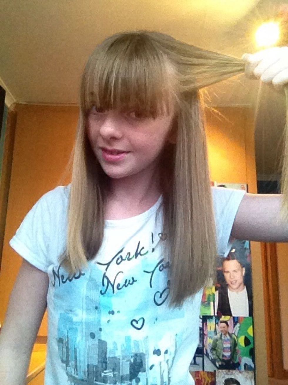 Take a bit of the front of your hair and section it off.